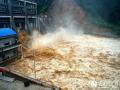 7月11日，融水县白云乡田寨水电站，洪水奔腾而下