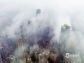 中国天气网讯 3月19日 ，南宁市雨雾交织，高层建筑若隐若现，空中俯视犹如仙境。（图/曾海科  文/郁海蓉） ​​​